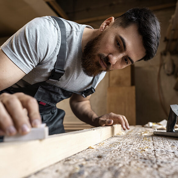 carpenter-cutting-mdf-board-inside-workshop (2)